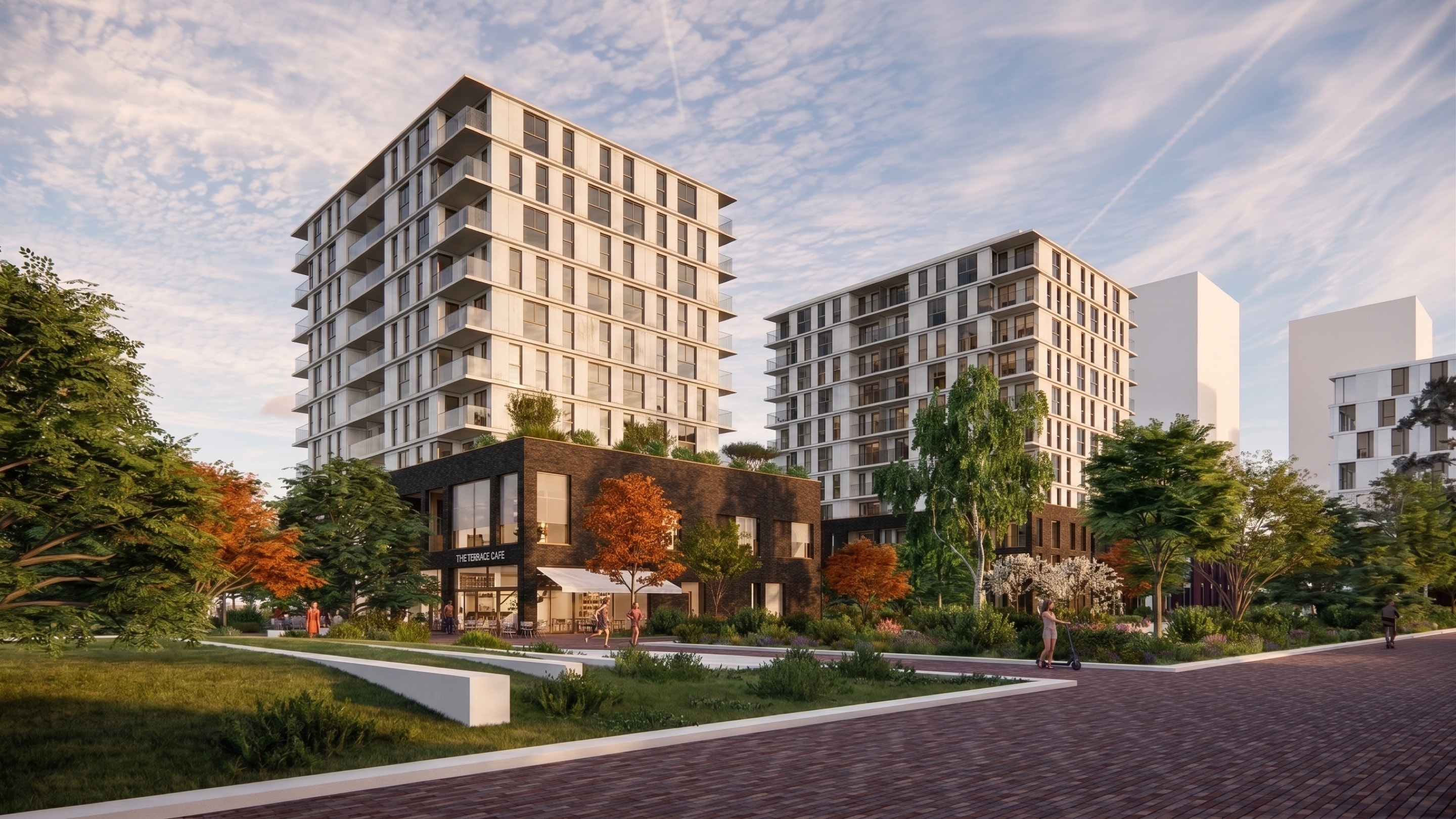 Render van een groene straat in MORE met twee woontorens en een paviljoen met café