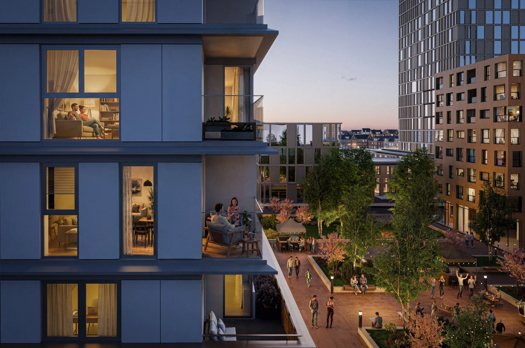 Evening impression of the balconies of MORE4, with residents on the terrace and the lit square below