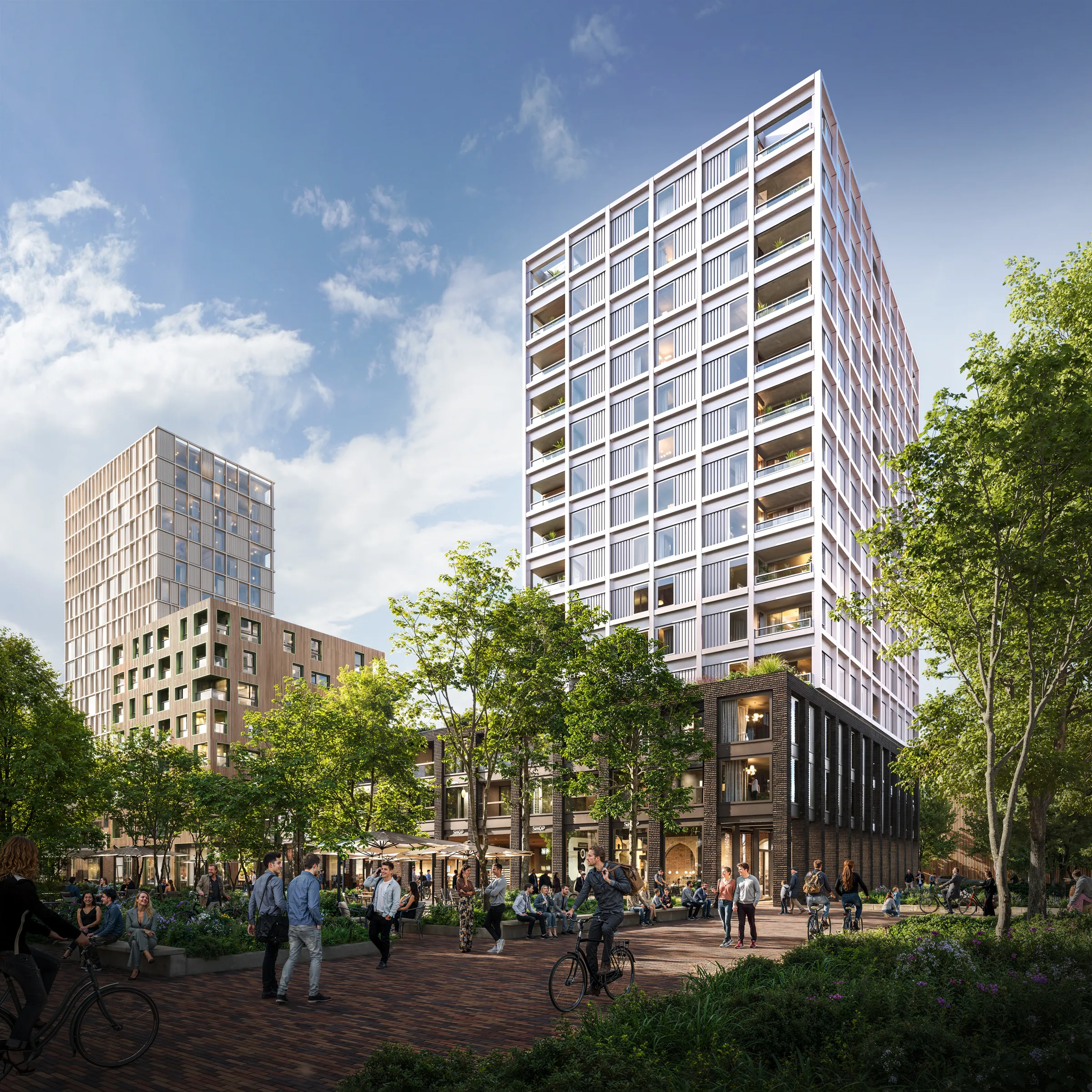 Impression of the MORE residential towers on the green square on a sunny day
